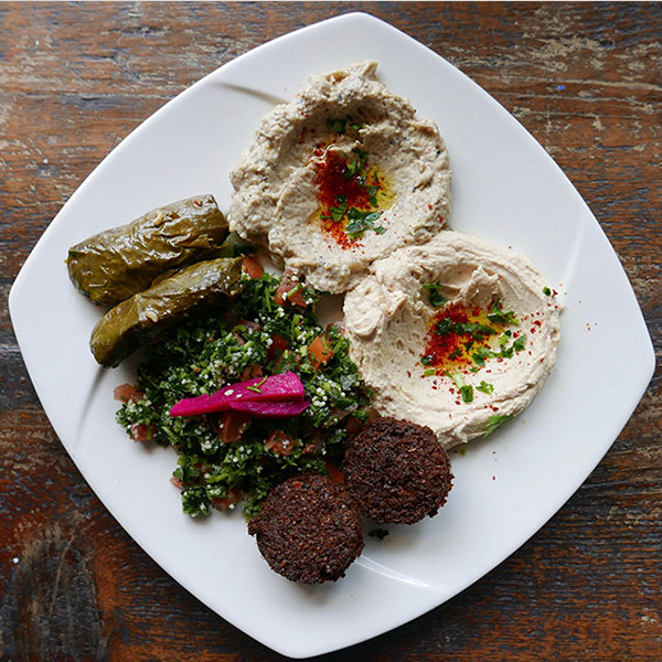 Hummus with falafel and stuffed grape leaves