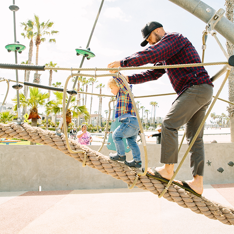 Adult and child playing at Ocean View Park in Santa Monica