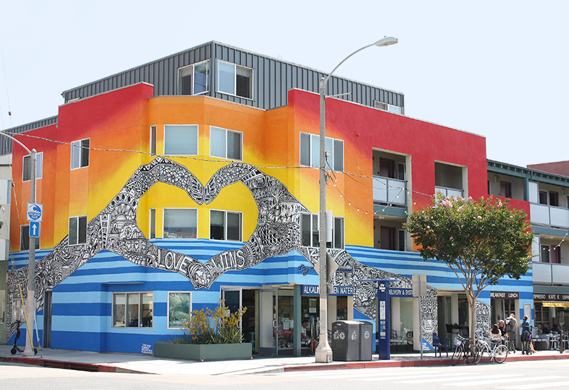 Hands forming heart shape mural