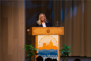 Misti Kerns, President and CEO of SMTT, accepts the Economic Excellence Award on behalf of Santa Monica's tourism industry.