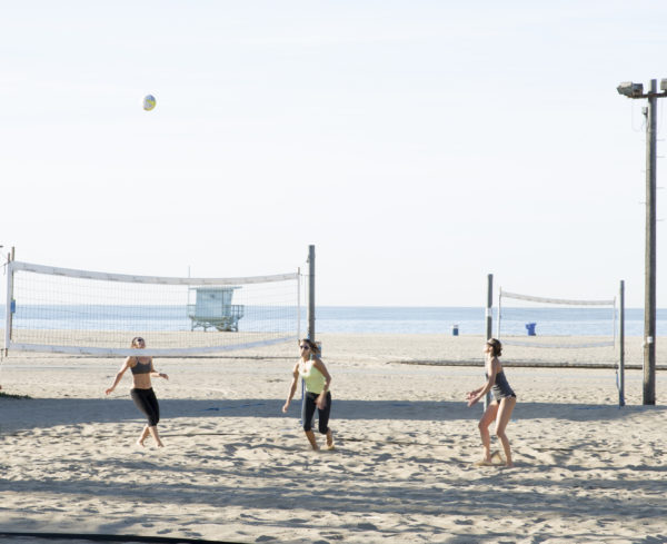 Group of women playing volleyball on Santa Monica Beach