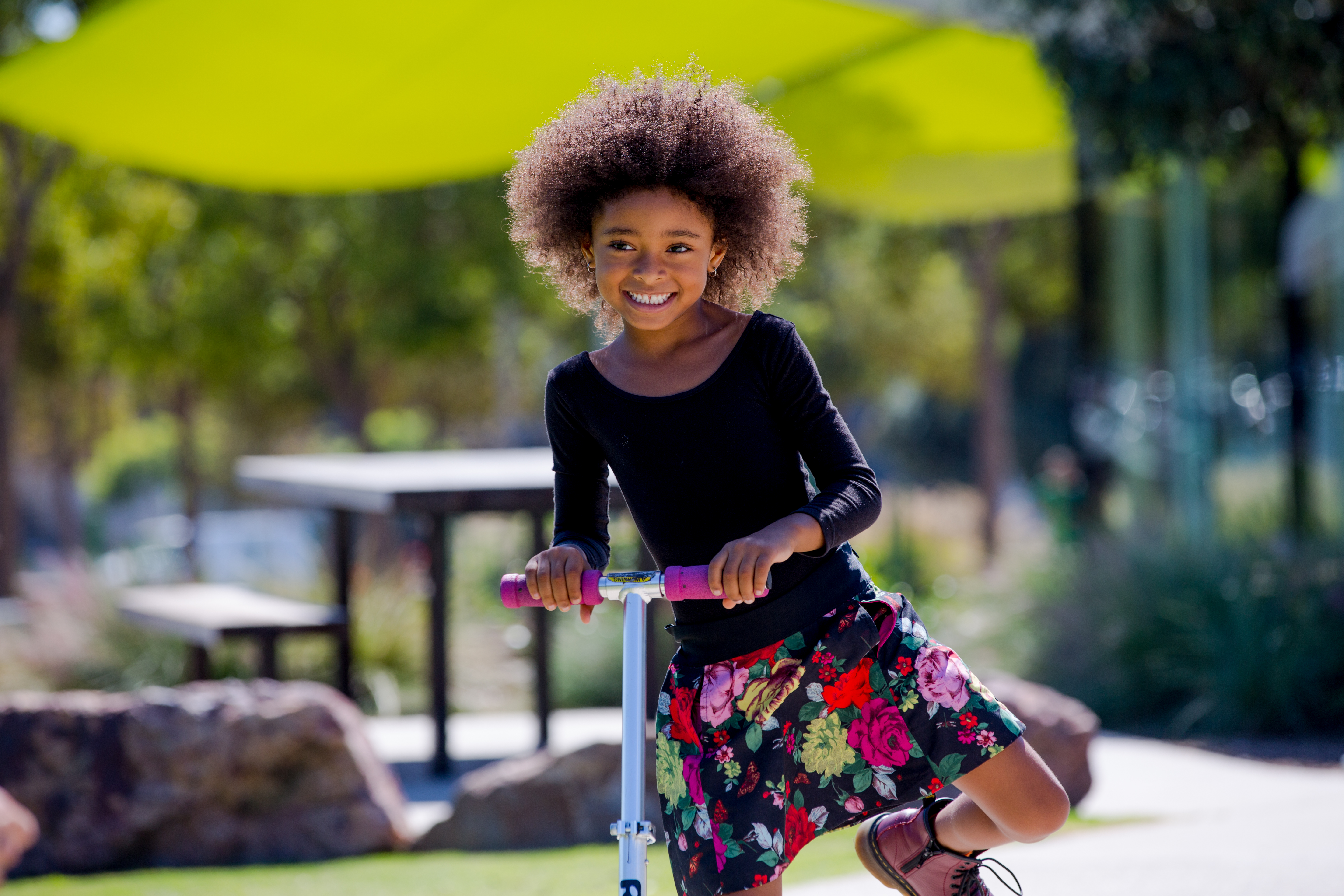 Girl riding scooter in Tongva Park