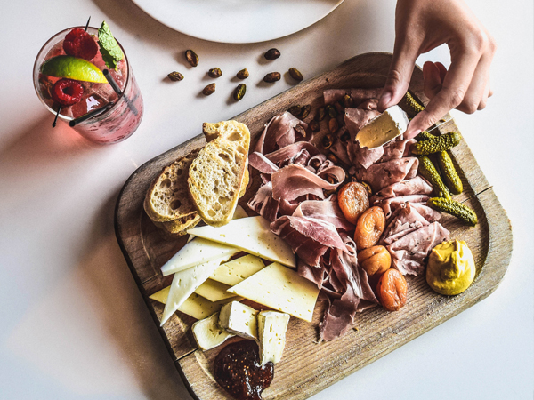 Charcuterie board and cocktail from Longitude Bar + Bistro