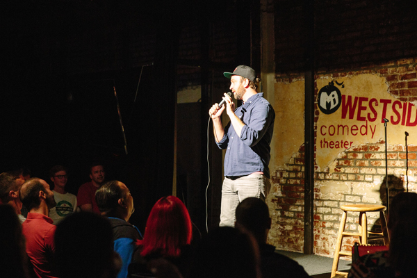 Comedian onstage at Mi's Westside Comedy Theater