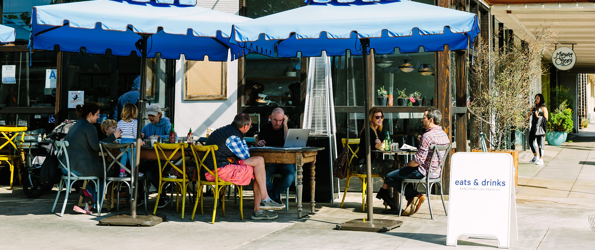 People enjoying outdoor dining on sunny day at Bardonna in Santa Monica