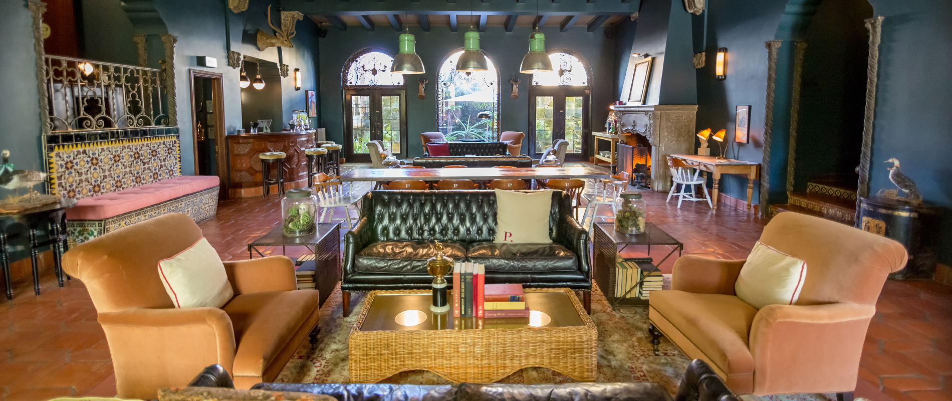 The Lobby at Palihouse Hotel in Santa Monica featuring wood beams and velvet furniture.