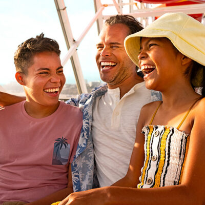 Boy and girl and their father on the Santa Monica Ferris wheel