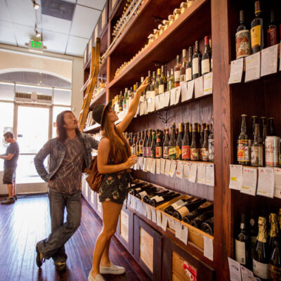 A couple shopping at Andrew's Cheese Shop on Montana Ave