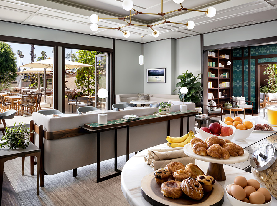 Hotel meeting space; natural light; fruit and breakfast foods laid out on bar