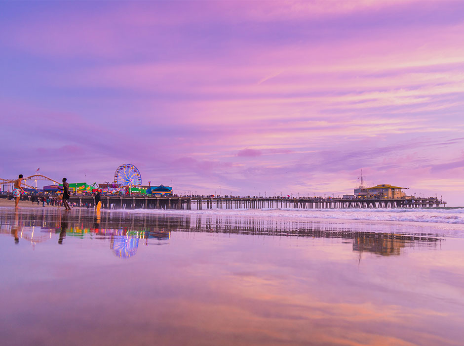 Santa Monica Beach and Pier at sunset with a purple hue