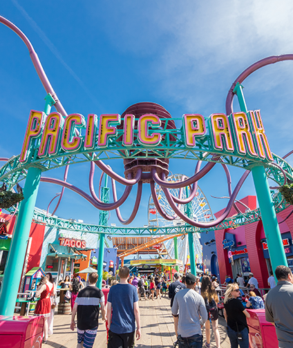 Sunny day at the Pacific Park entrance on Santa Monica Pier.