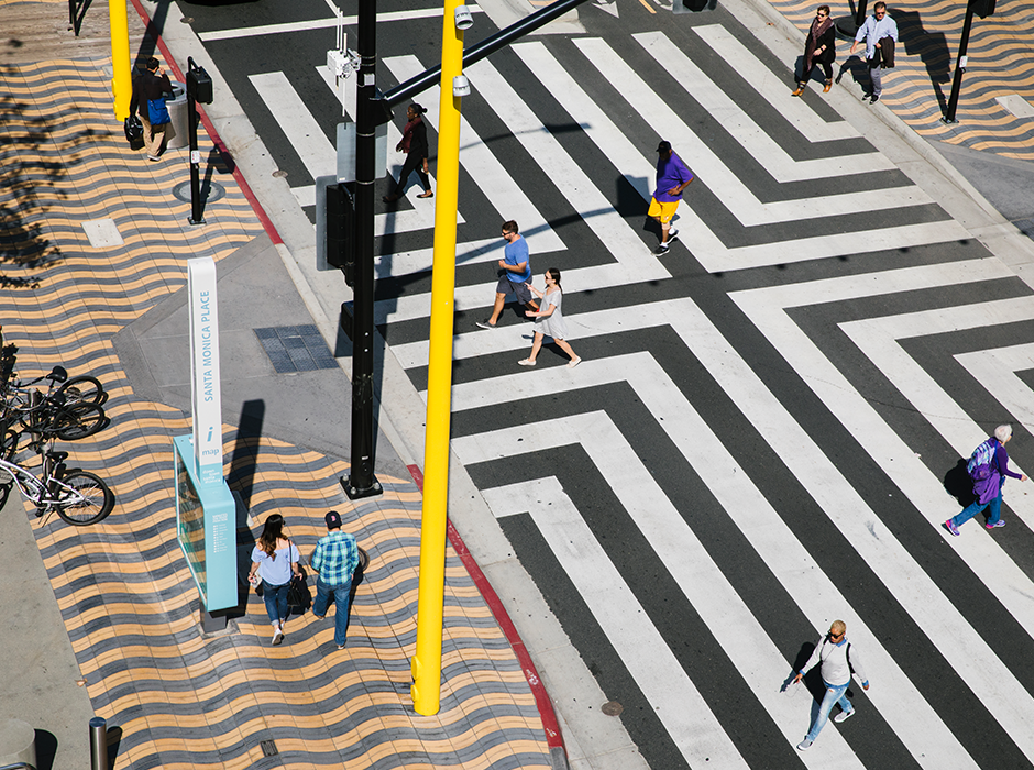 People walking and crossing street in Santa Monica.