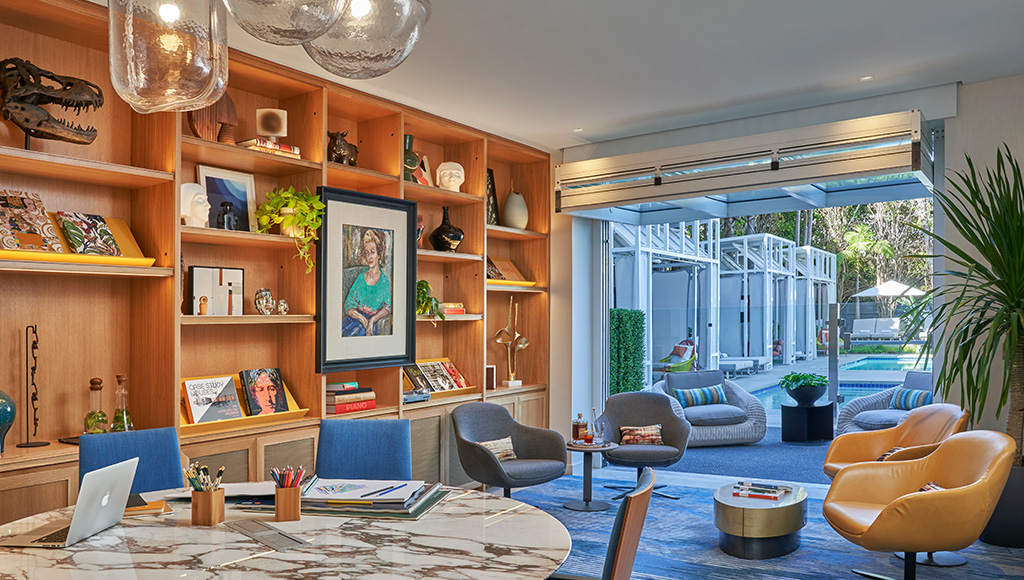 Viceroy Hotel meeting room with open garage style door; pool cabanas visible outside