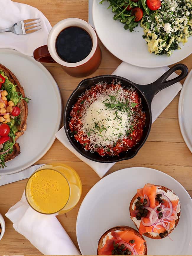 Picture of various food from Milo + Olive Santa Monica spread out on table
