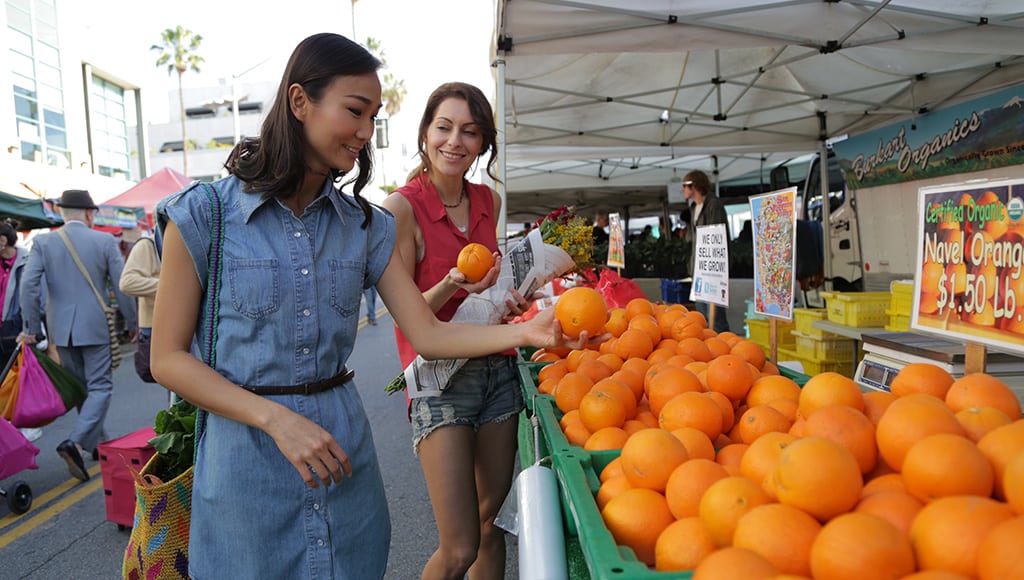 Travelers at farmers market