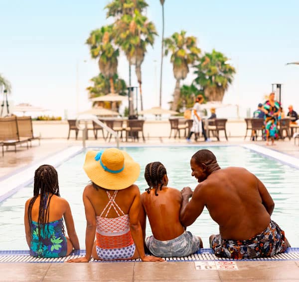 family at the pool at loews luxury santa monica hotel