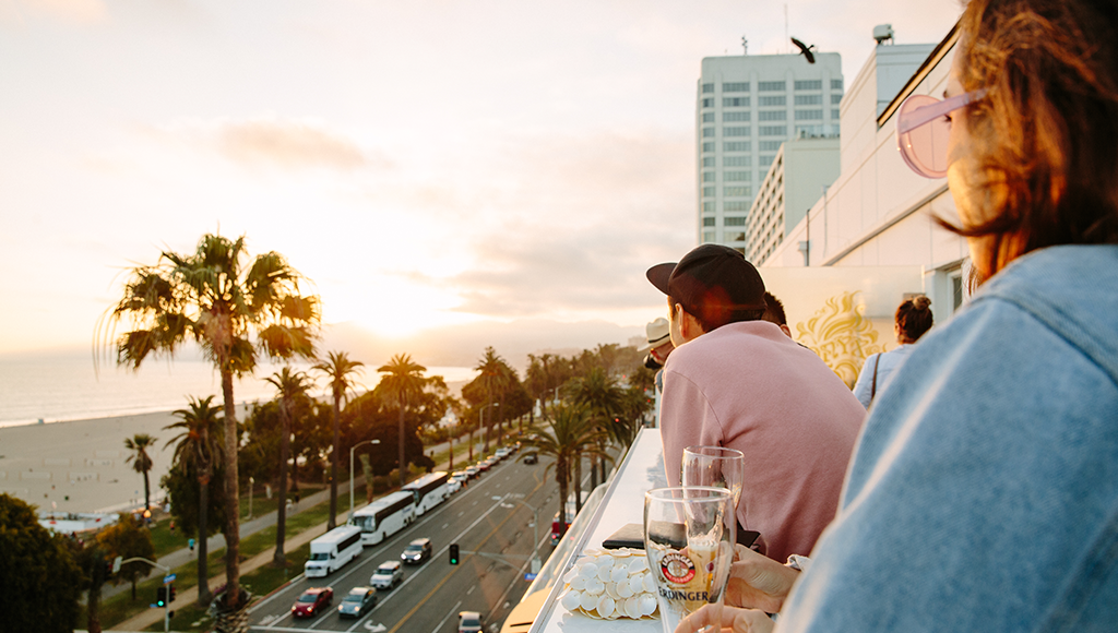 People enjoying a drink at the bar and watching sunset at Onyx in Santa Monica