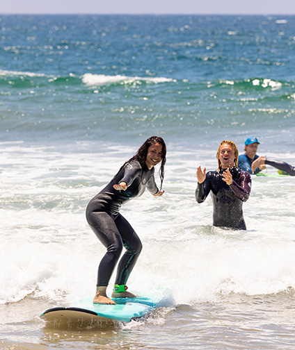 Woman standing on surfboard on the water in santa monica