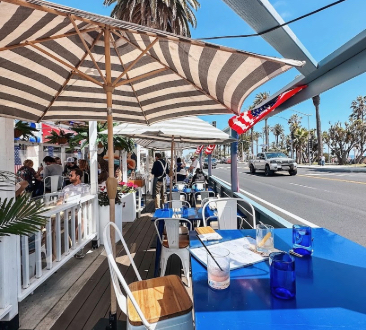 outside seating of table and umbrella