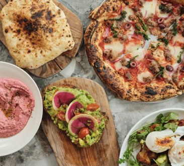 photo of pizza and other food items