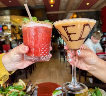 two drinks cheersing
